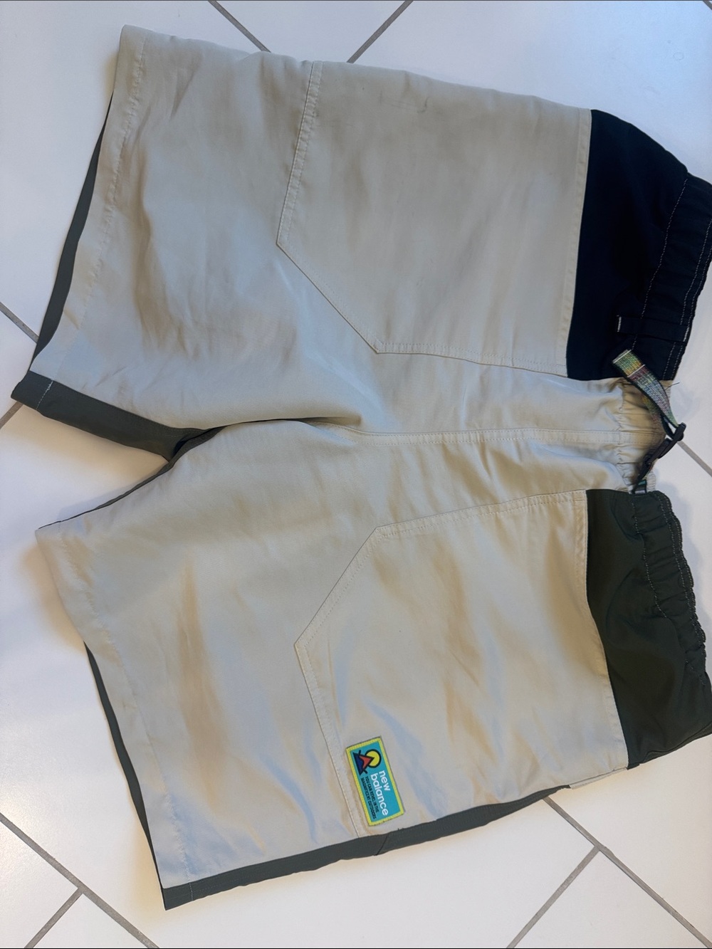 New Balance Khaki Shorts with Dark Olive Trim and Bright Patch